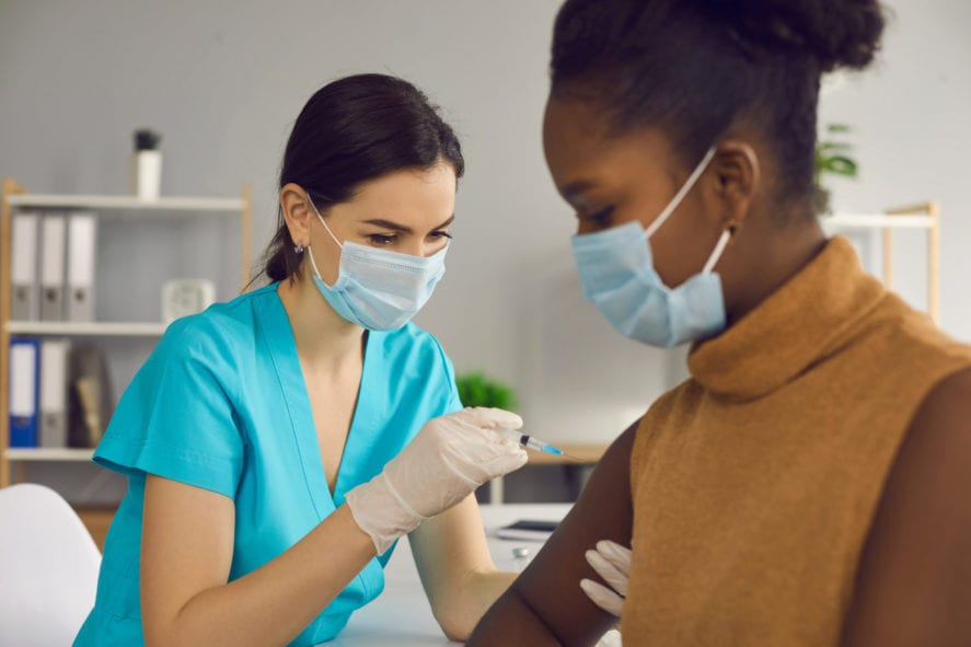 Professional,Nurse,Or,Doctor,In,Medical,Face,Mask,And,Gloves - 92.5 The Beat