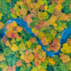 1879350385_SmugglersNotch - 92.5 The Beat Panoramic view of peak fall foliage in Smugglers Notch, Vermont | Shutterstock